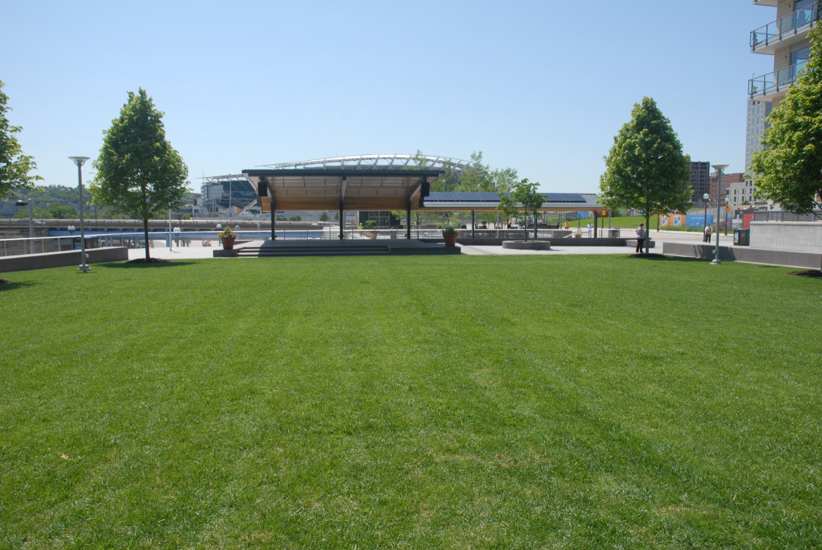 A wide, evenly mowed open lawn